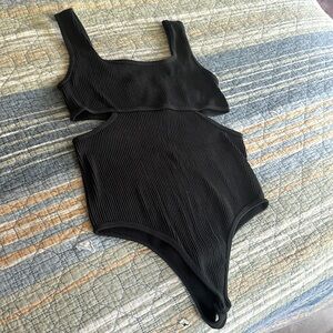 Cute bodysuit. Soft, Textured nylon/knit material. NWT never worn.